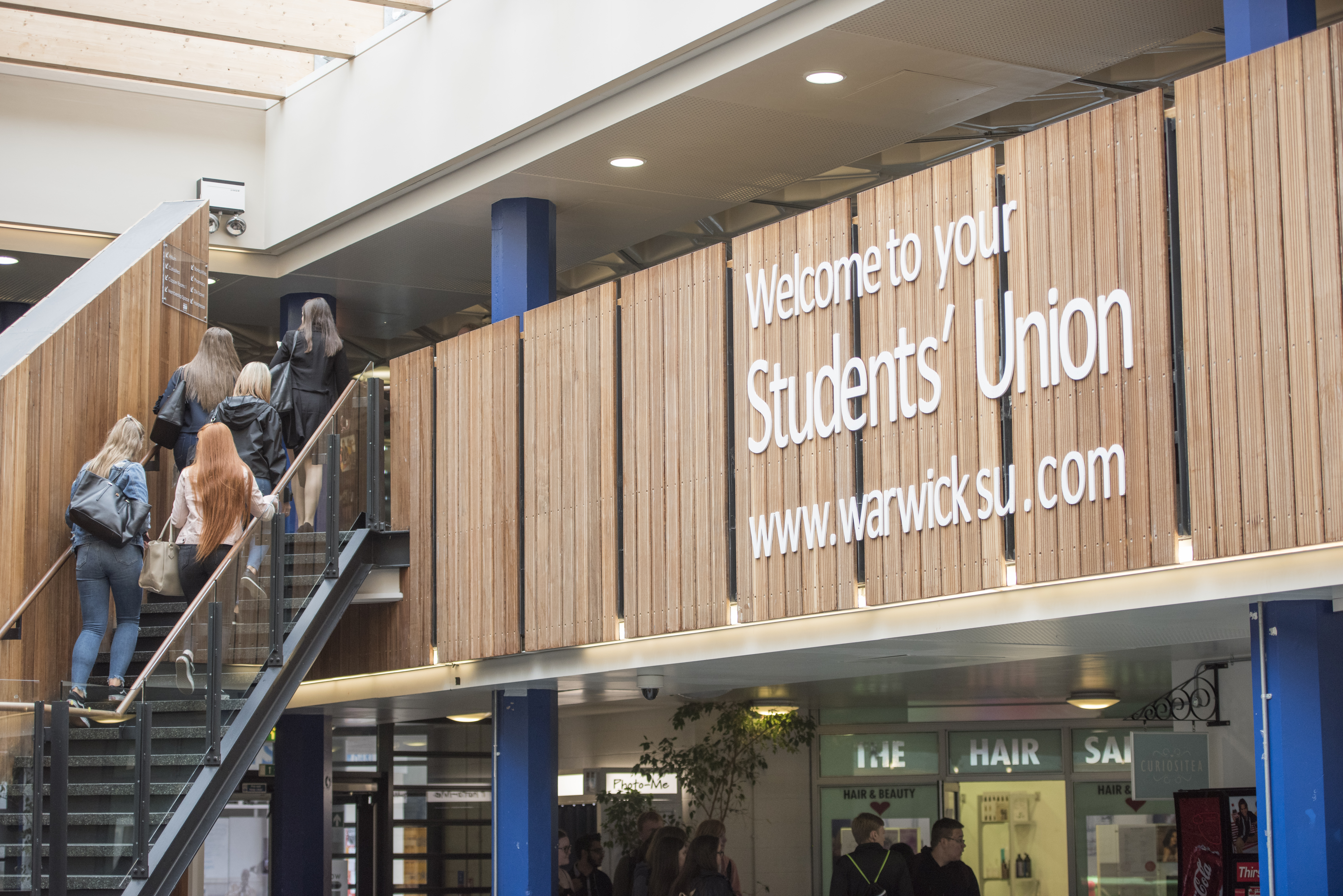 WarwickSU.com provides students with essential updates, including the Term 2 Impact Report, the All Student Vote, and the Eat Well Hub. It features officer reports on welfare and societies, postgraduate surveys, and information on various student support initiatives and campus campaigns.